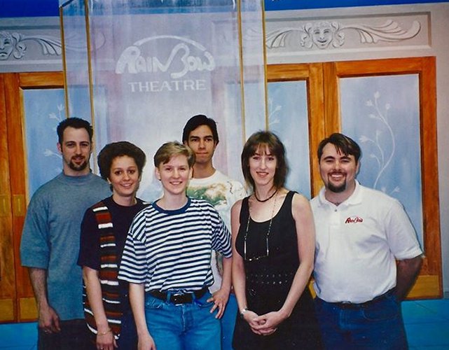 Happy Rhodes with Mike Brewer (right) and employees of Rainbow Records. Date unknown.